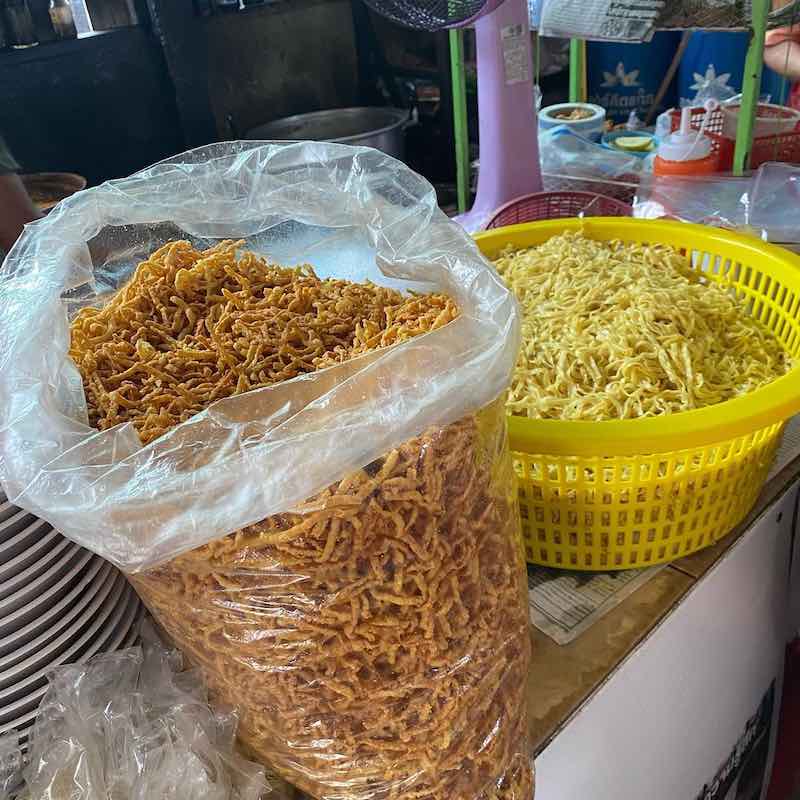 Khao soi noodles - fresh (right) and fried (left)